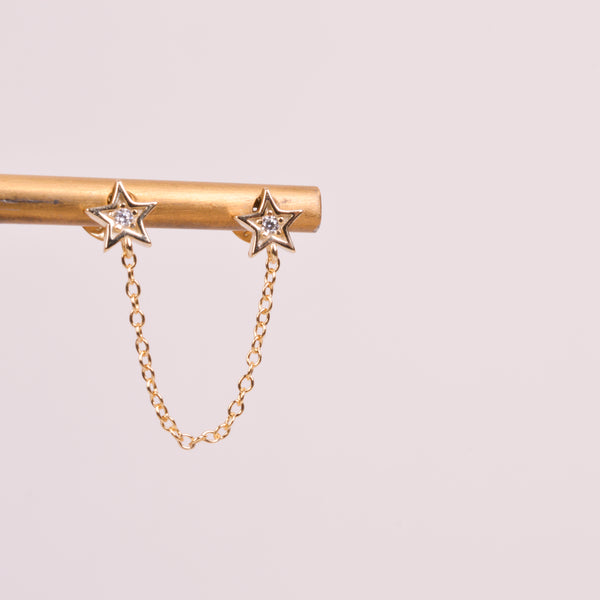 04649 Arete para piercing estrellas con cadena dorado