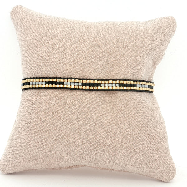 25-7957 Pulsera negro y blanco con dorado